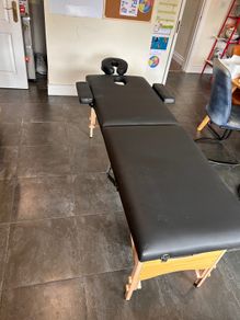 Folding massage table