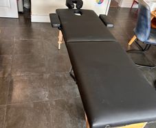 Folding massage table