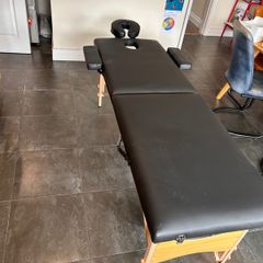 Folding massage table