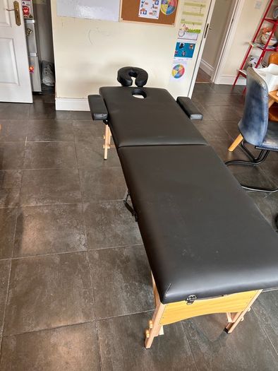 Folding massage table
