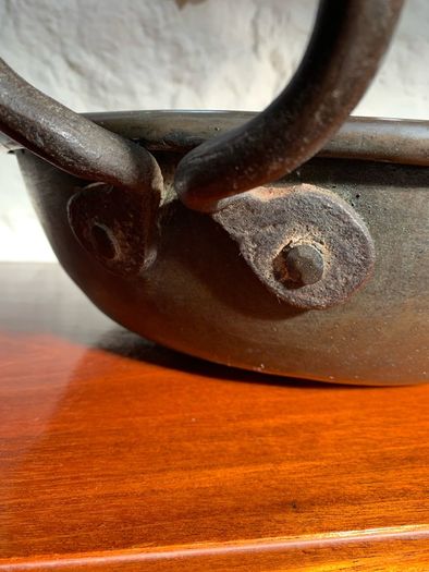 Large heavy antique copper dish with ring handles.