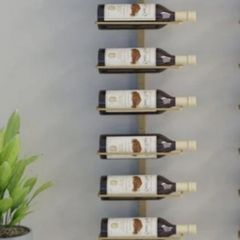 Modern hanging wine rack in gold color.