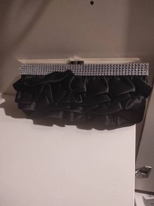Black ruffle clutch with silver chain