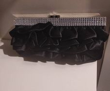 Black ruffle clutch with silver chain