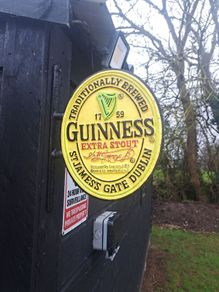 Guinness  2 sided cast iron sign