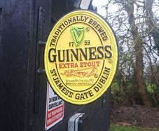 Guinness  2 sided cast iron sign