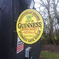 Guinness  2 sided cast iron sign