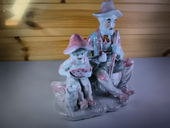 Vintage Porcelain Man with a Girl Eating WaterMelon God Log