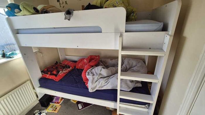 White bunk beds with ladder