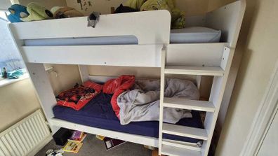White bunk beds with ladder