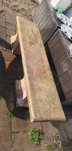 Sandstone garden table and two benches.