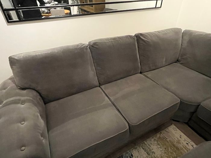 Grey corner sofa with matching footstool