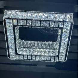 Crystal Chandelier with stainless steel and mirrored finish. 3 colour options. Remote Control.