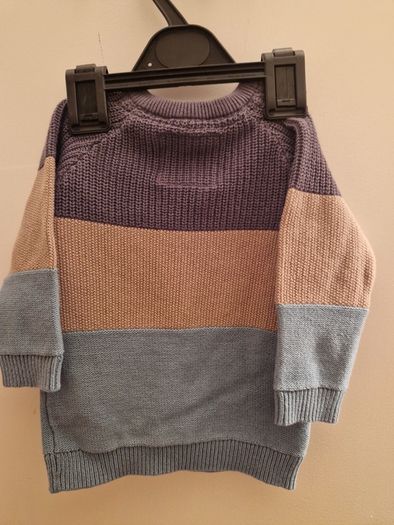 A selection of brand new baby clothes and items