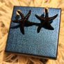 Small Shiny Earrings with Black Starfish Motif Elegant Minimal Style Image 4