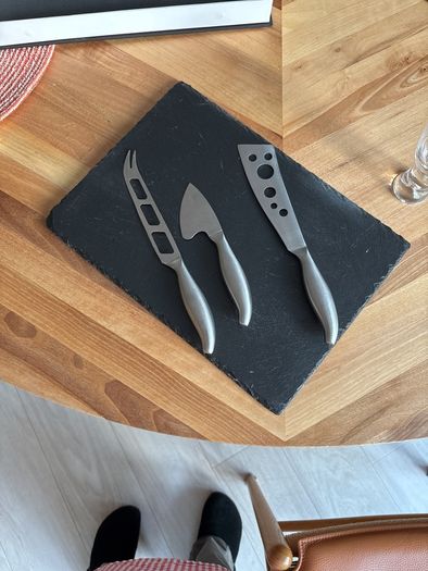 cheese board with cheese knives