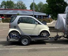 Smart Car and Brian James Trailer