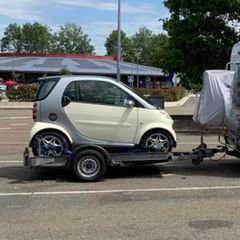 Smart Car and Brian James Trailer