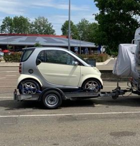 Smart Car and Brian James Trailer