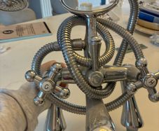 Telephone style bath/shower mixer tap