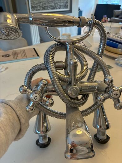Telephone style bath/shower mixer tap
