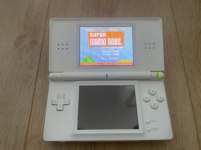 Modded Nintendo DS Lite crystal white USG 001 boxed with manual with Flash Card 32gb with Games and retro games (Neo Geo, Nes, Gameboy Color, Atari.