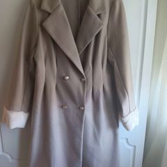 Double breasted Coat in a neutral beige and faux fur.