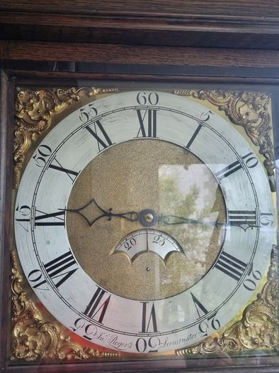 A Georgian grandfather clock made by the English clockmaker John Rogers of Leominster