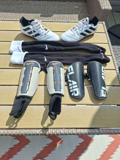 Addidas football boots, shin guards and socks.