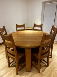 solid oak dining table and 6 chairs