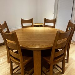 solid oak dining table and 6 chairs