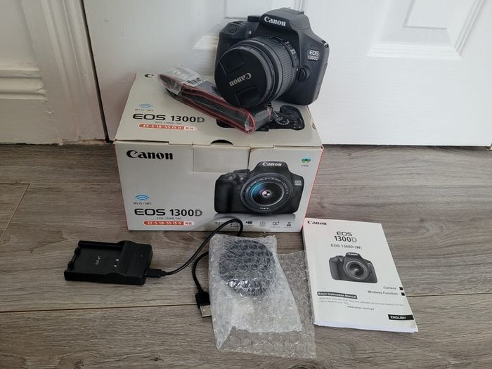 Canon EOS 1300D DSLR in box with lens