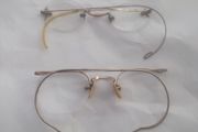 a pair of antiques spectacles in there case