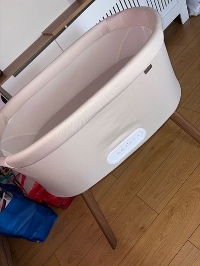Nested motion electric bedside crib