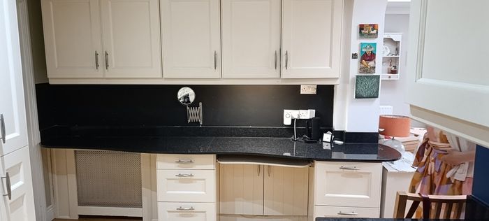 kitchen cabinets and black marble countertop