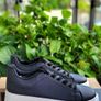 Black sneakers with thick white sole Image 2