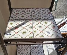 Decorative metal shelving unit with tiles