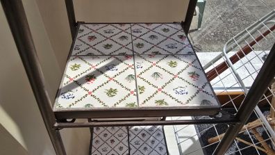 Decorative metal shelving unit with tiles