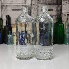 328 - Set of 2 Vintage Clear Glass Collectible Decorative Swirls Bottles