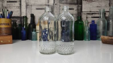 328 - Set of 2 Vintage Clear Glass Collectible Decorative Swirls Bottles