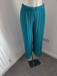 Worn once, like new. Fully lined beautiful dressy Turquoise pleated trousers. Fit 10-14.