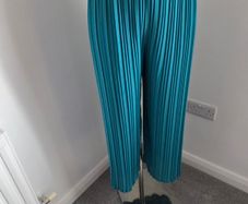 Worn once, like new. Fully lined beautiful dressy Turquoise pleated trousers. Fit 10-14.