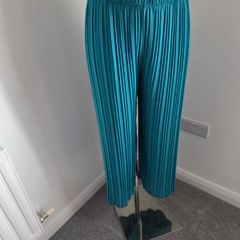 Worn once, like new. Fully lined beautiful dressy Turquoise pleated trousers. Fit 10-14.