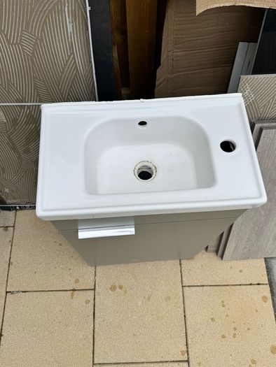 Narrow Sink Along With Vanity Unit And Pipes; Kitchen Sink And Quartz Worktop Unit With Wooden Inparts