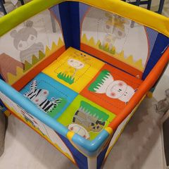 Bright and colorful square baby playpen featuring a cheerful animal safari theme.