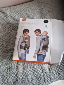 baby carrier , sling