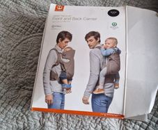 baby carrier , sling