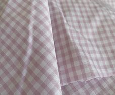 Over 20 m x 1.1 m of a pretty pink lilac gingham check fabric