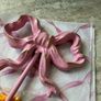 Large 13cm high x 10cm width metal bow hook in bubblegum pink with gold detail Image 7