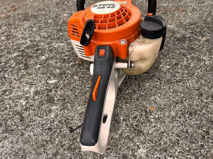STIHL HS 45 petrol hedge trimmer with 24-inch double-sided cutting blade.